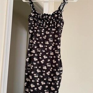 Black and white floral mini dress. No tag but fits like a medium.